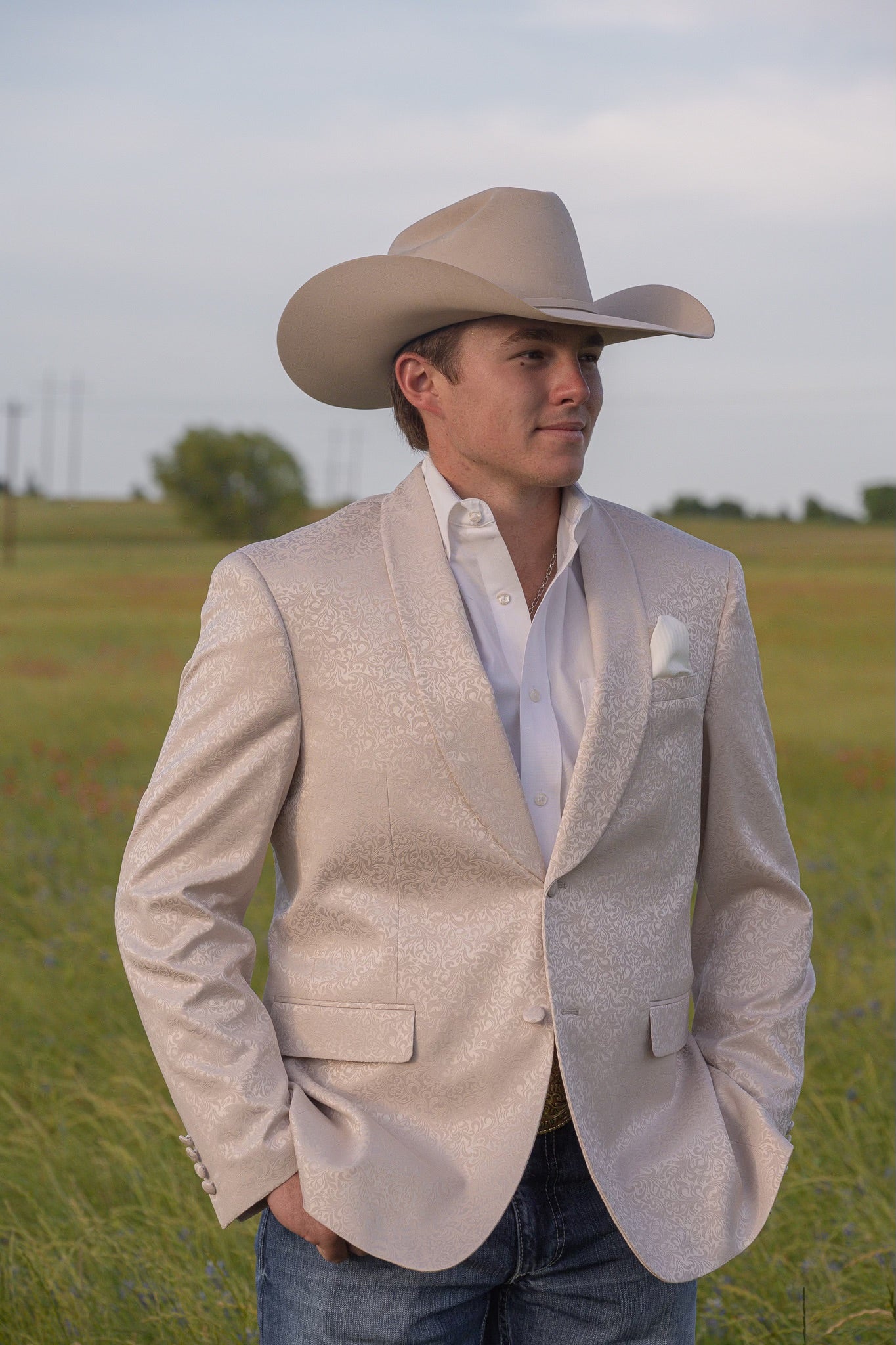 Cowboy groom in cream paisley Western formal jacket perfect for Western wedding outfit
