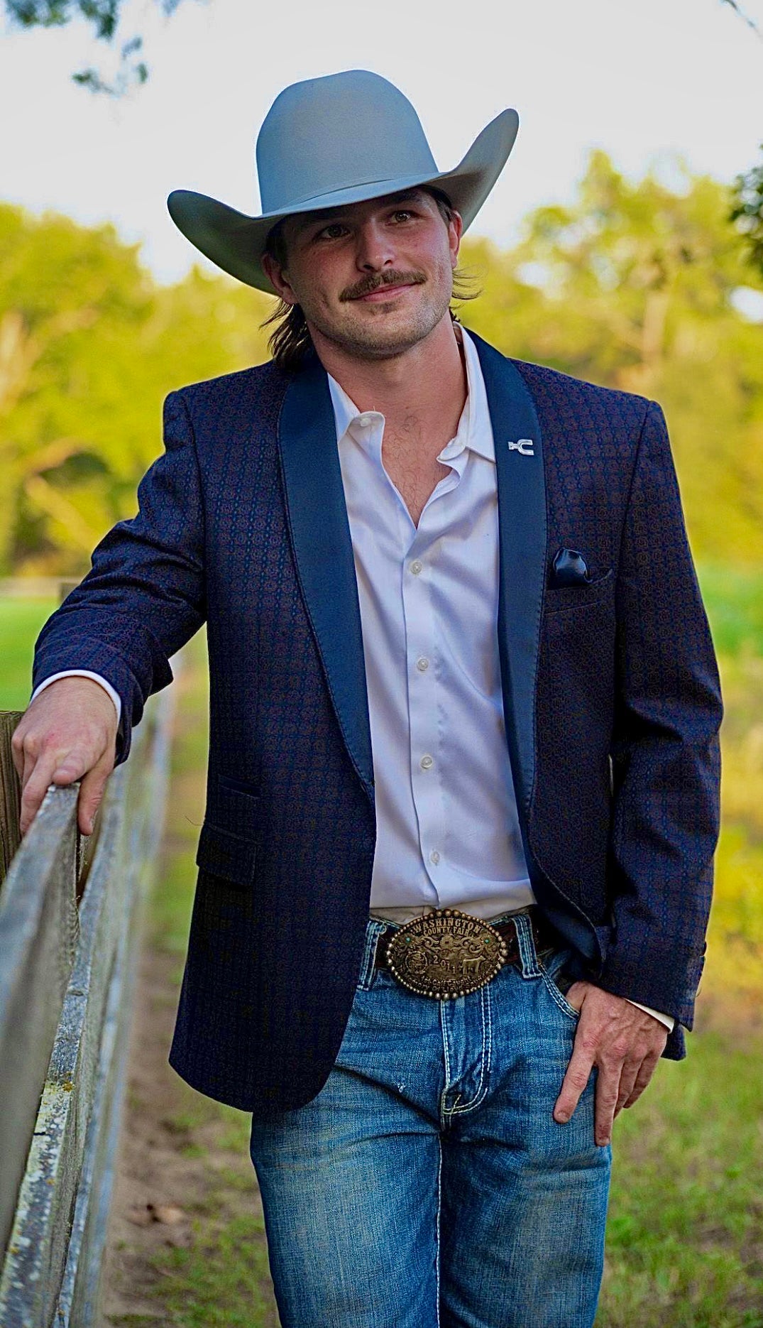 Close-up of navy etched paisley pattern on Espuela Design Co. Hugh Heff Cowboy Smoking Jacket.